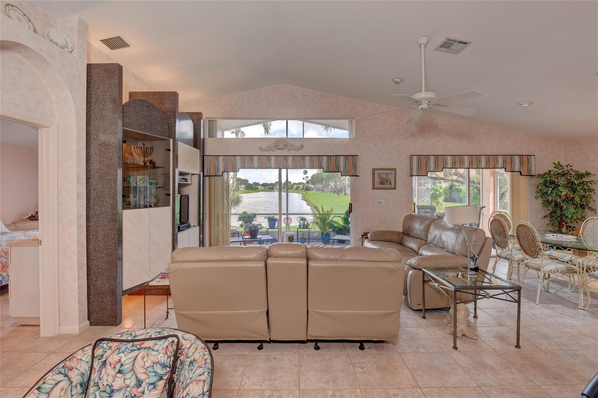 22918 Sterling Lakes Drive Boca Raton, FL 33433 - Photo 16 of 57 a living room with furniture and a large window