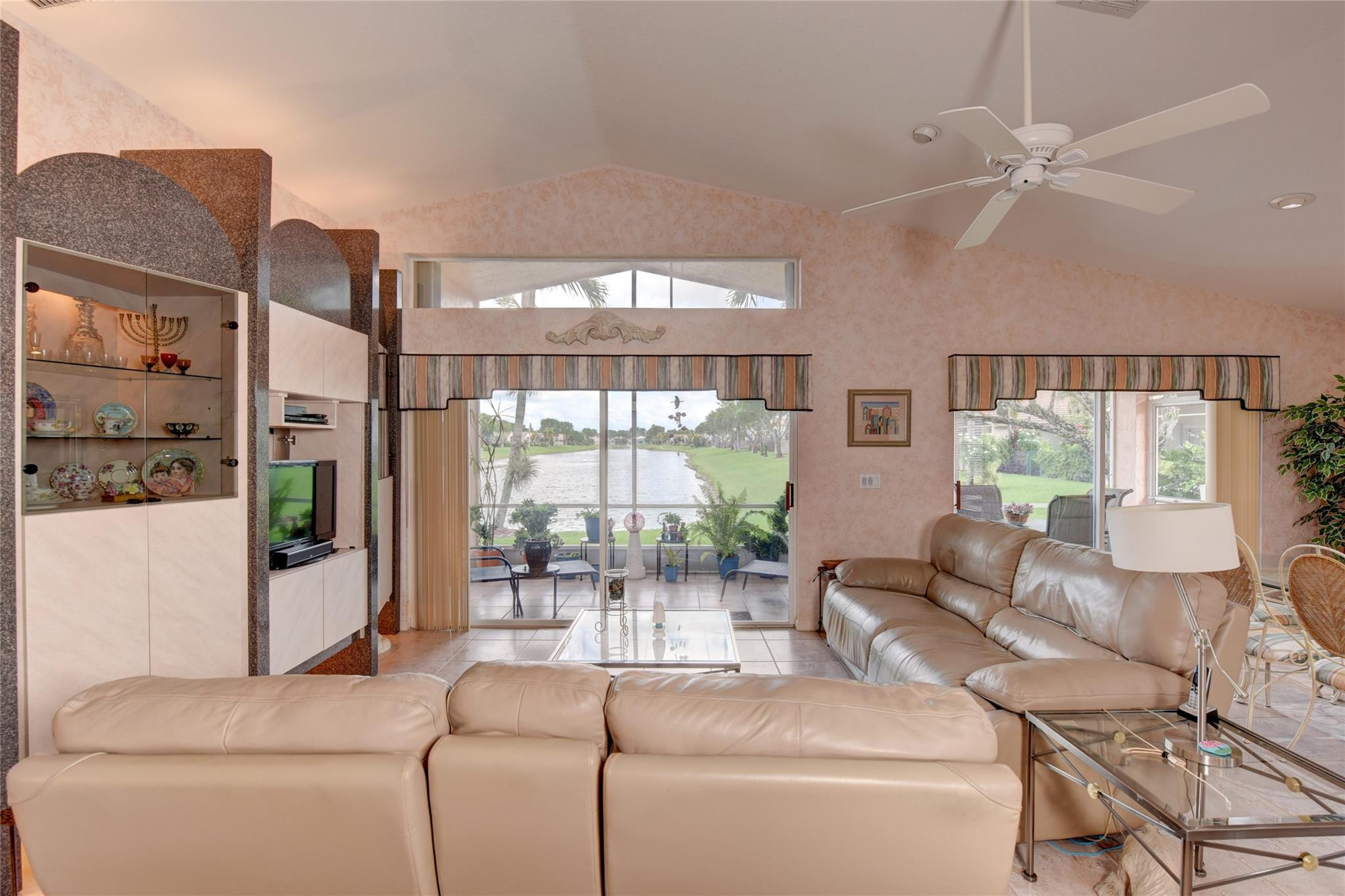 22918 Sterling Lakes Drive Boca Raton, FL 33433 - Photo 17 of 57 a living room with furniture and a large window