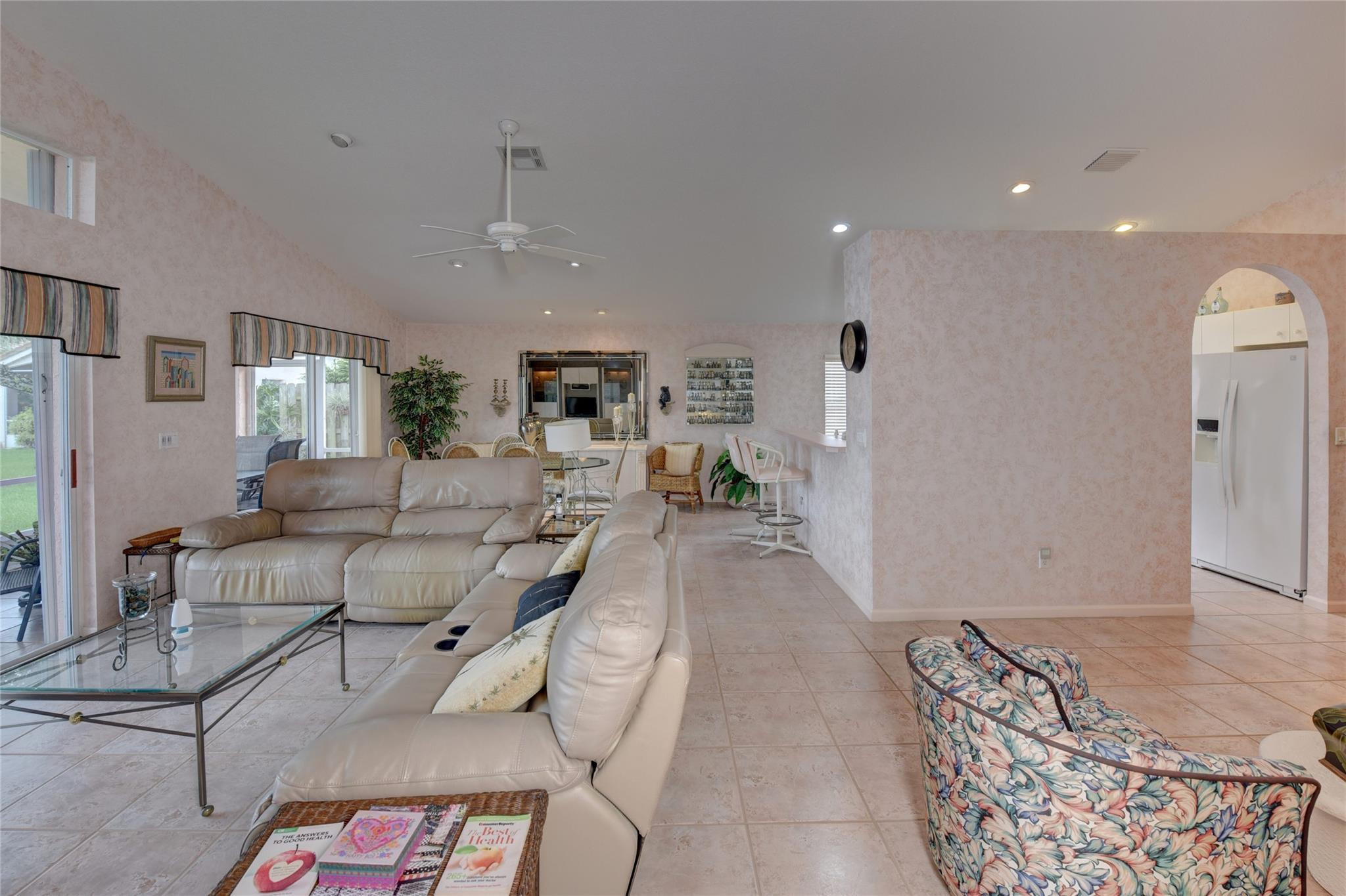 22918 Sterling Lakes Drive Boca Raton, FL 33433 - Photo 18 of 57 a living room with furniture and a chandelier