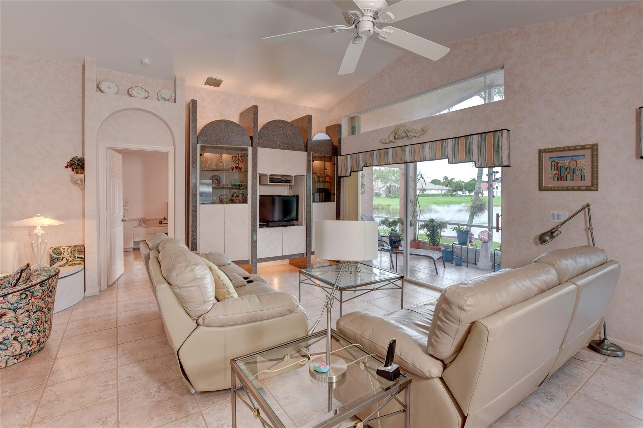 22918 Sterling Lakes Drive Boca Raton, FL 33433 - Photo 20 of 57 a living room with furniture and a large window