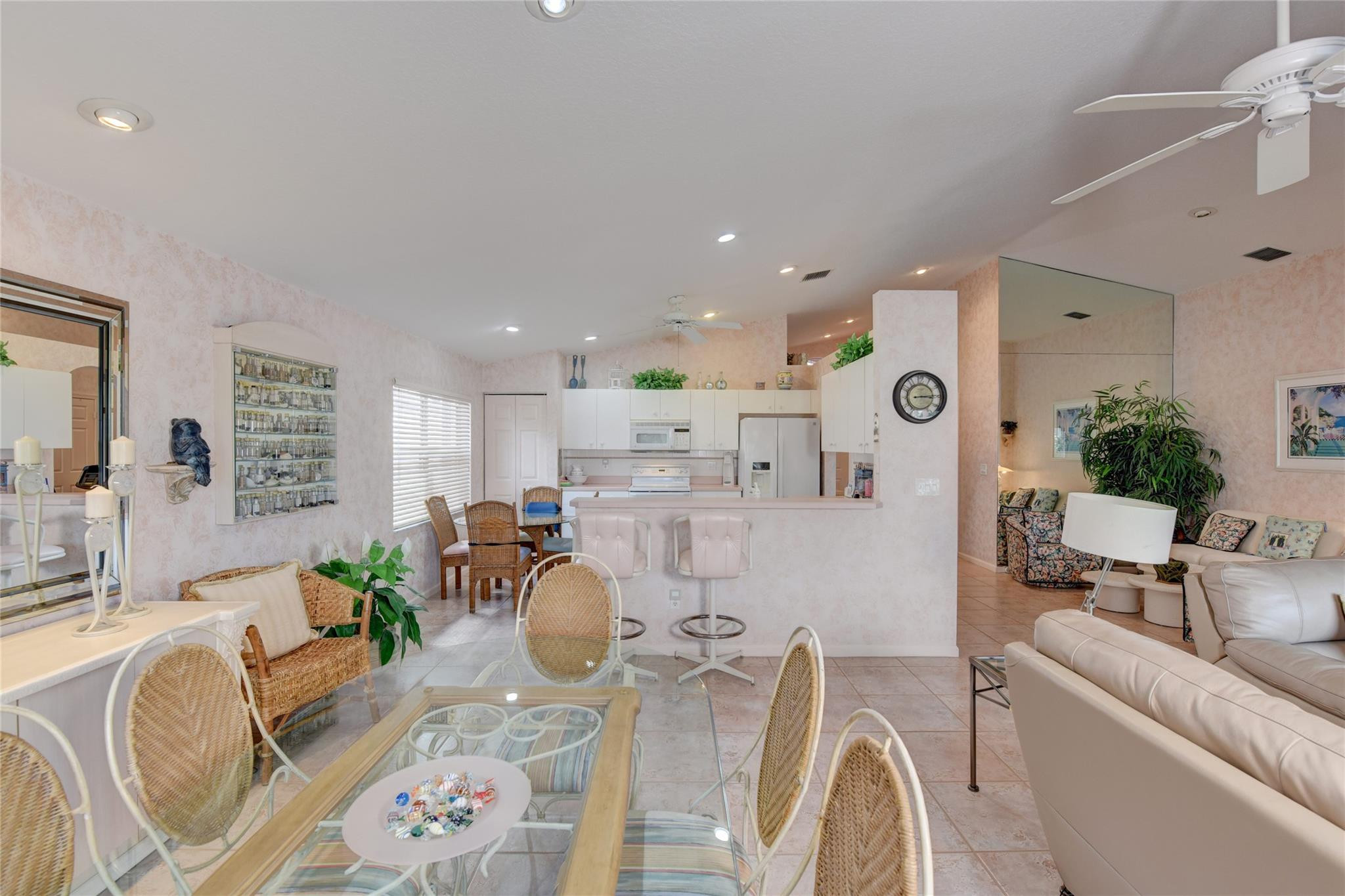 22918 Sterling Lakes Drive Boca Raton, FL 33433 - Photo 23 of 57 a living room with furniture and a wooden floor