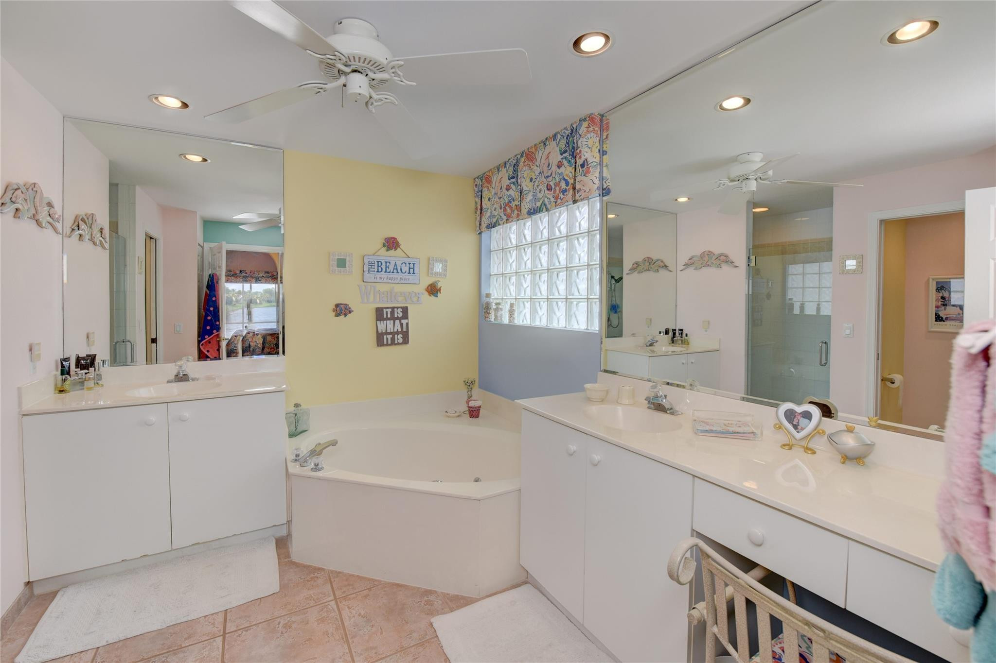 22918 Sterling Lakes Drive Boca Raton, FL 33433 - Photo 32 of 57 a bathroom with a sink double vanity granite tub shower and a mirror