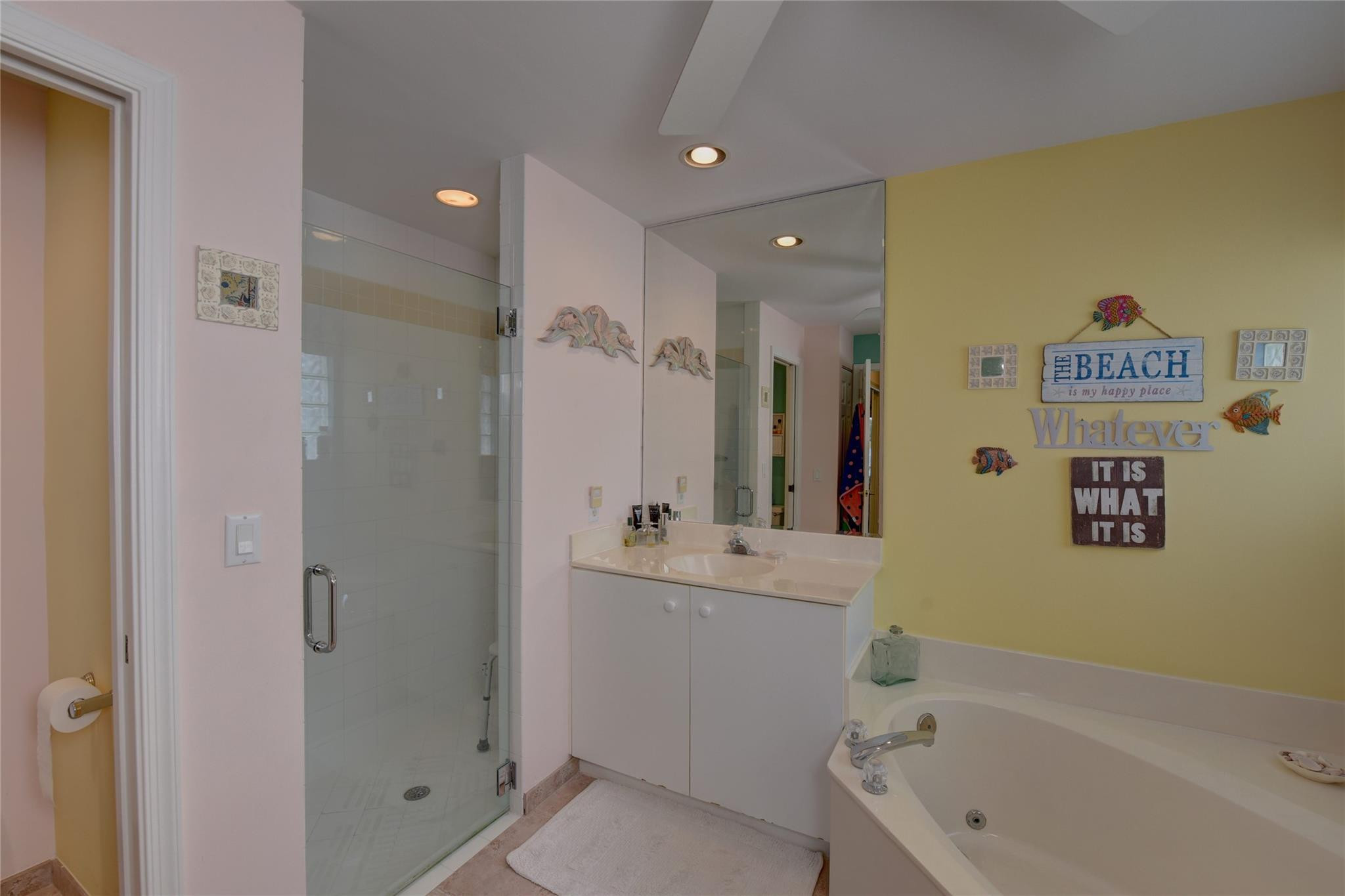22918 Sterling Lakes Drive Boca Raton, FL 33433 - Photo 33 of 57 a bathroom with a bathtub shower sink vanity and toilet