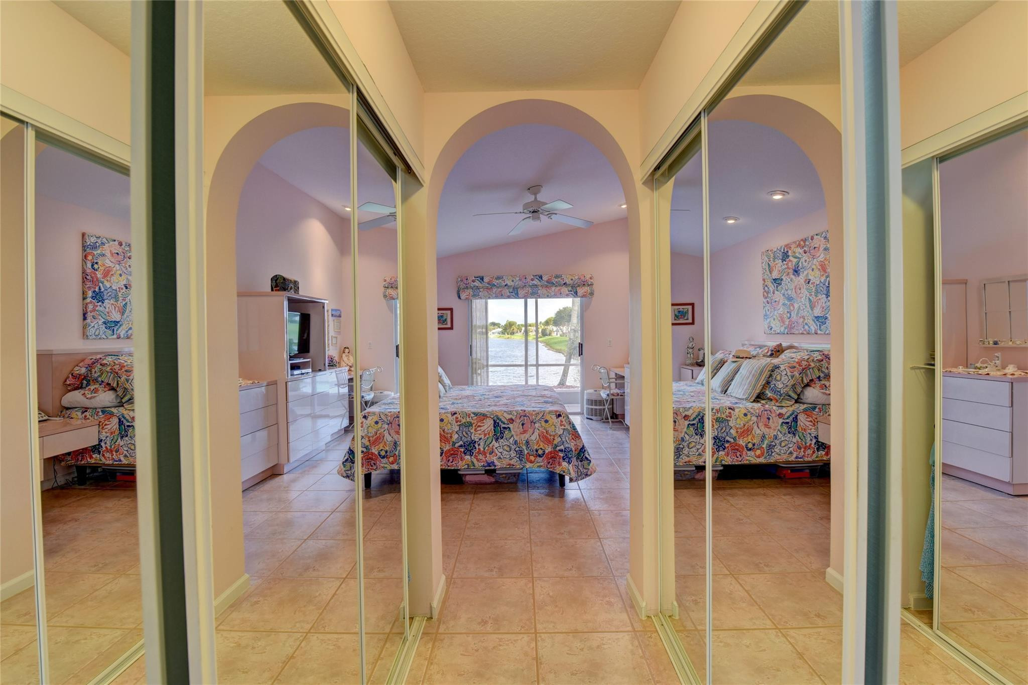 22918 Sterling Lakes Drive Boca Raton, FL 33433 - Photo 35 of 57 a en suite bathroom with a tub and view of living room