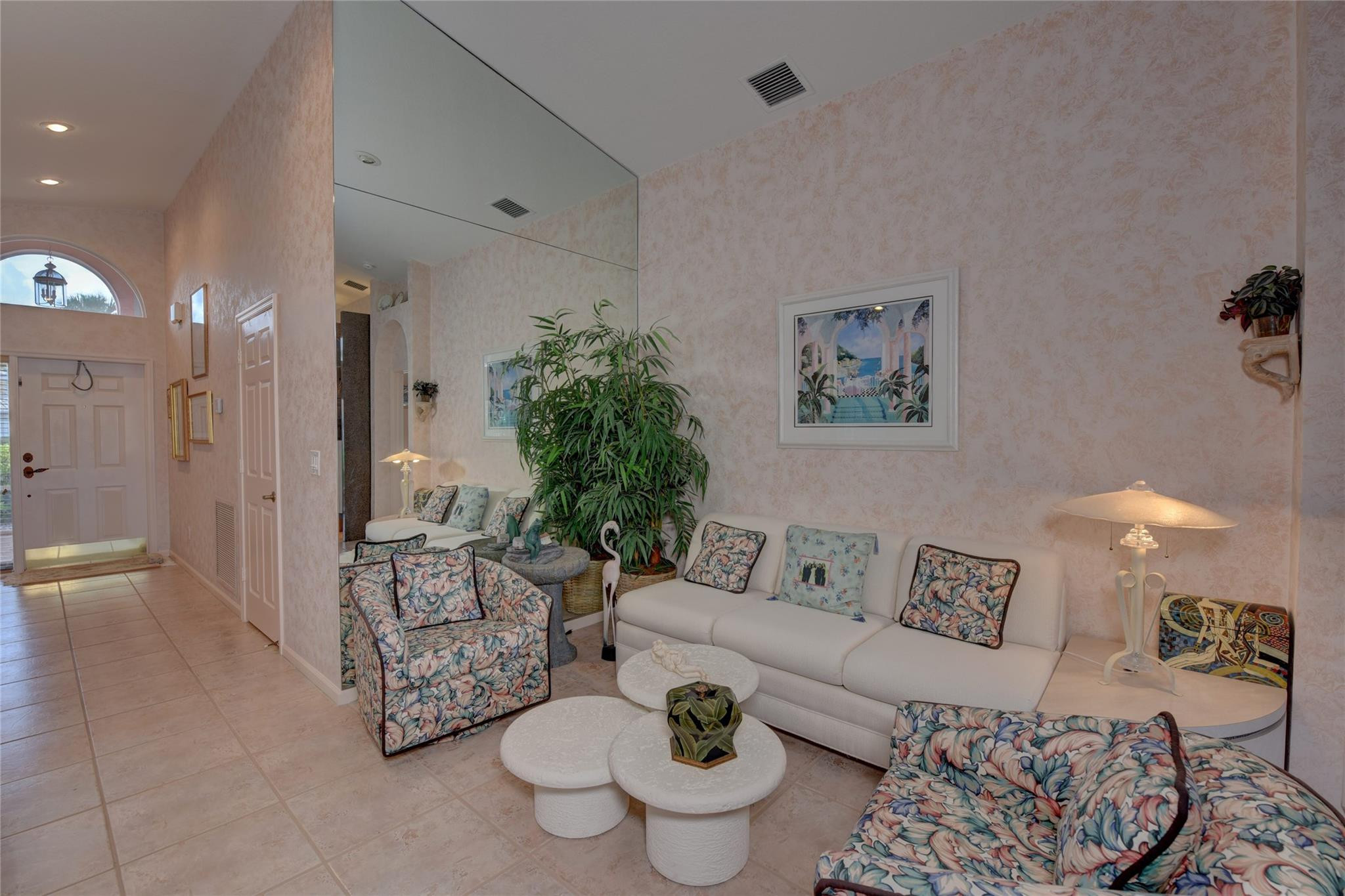 22918 Sterling Lakes Drive Boca Raton, FL 33433 - Photo 36 of 57 a living room with furniture and a chandelier