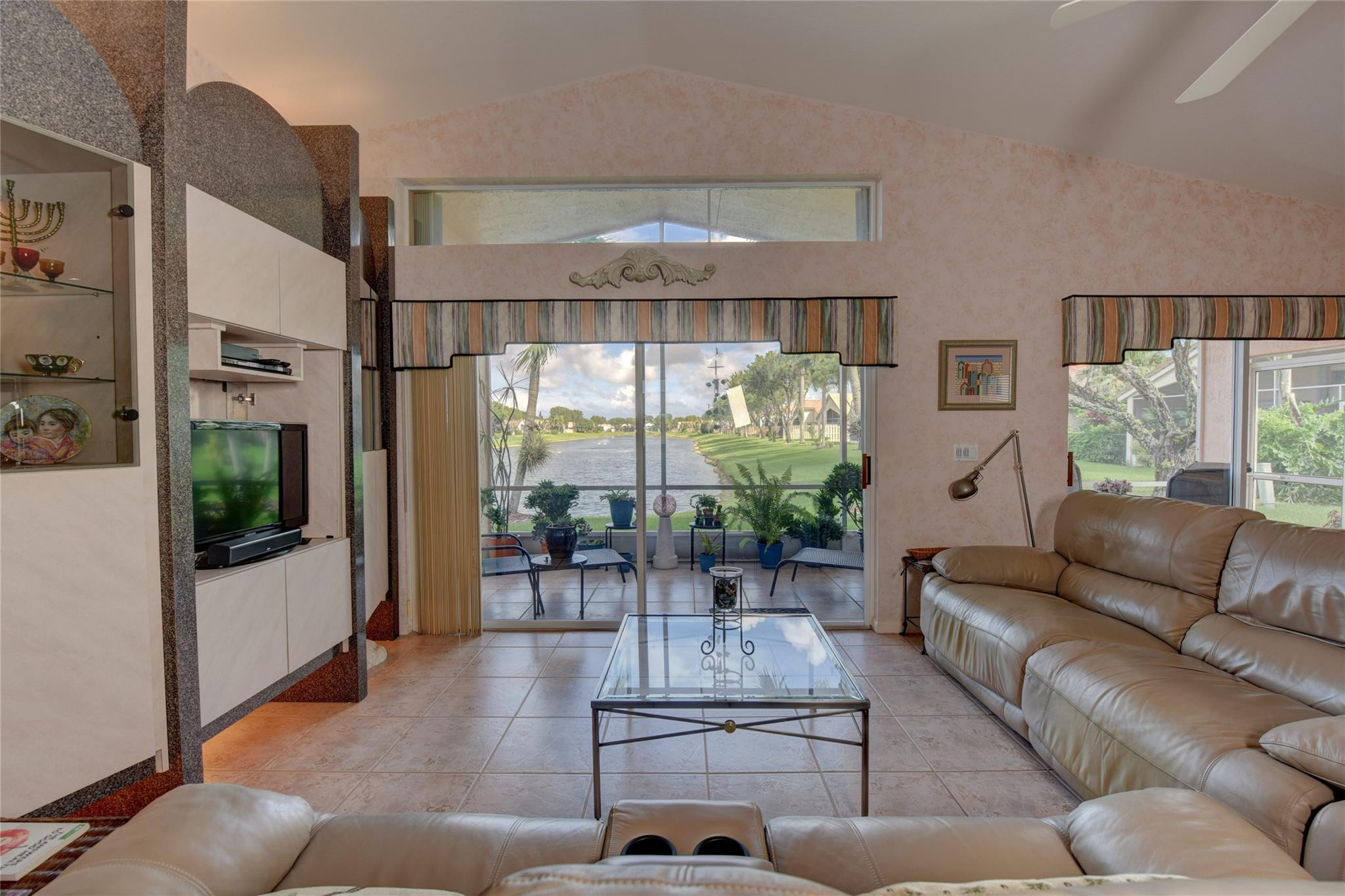22918 Sterling Lakes Drive Boca Raton, FL 33433 - Photo 37 of 57 a living room with furniture and a large window