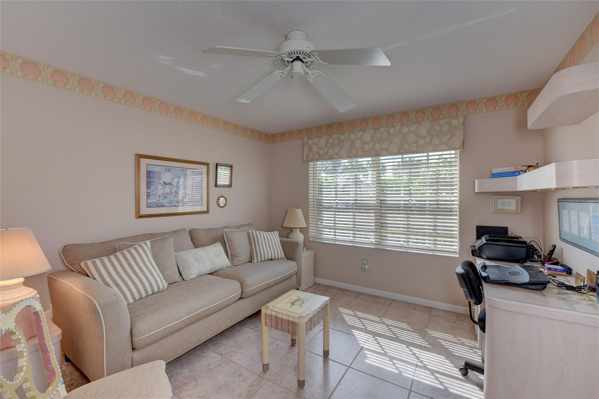 22918 Sterling Lakes Drive Boca Raton, FL 33433 - Photo 38 of 57 a living room with furniture and a window