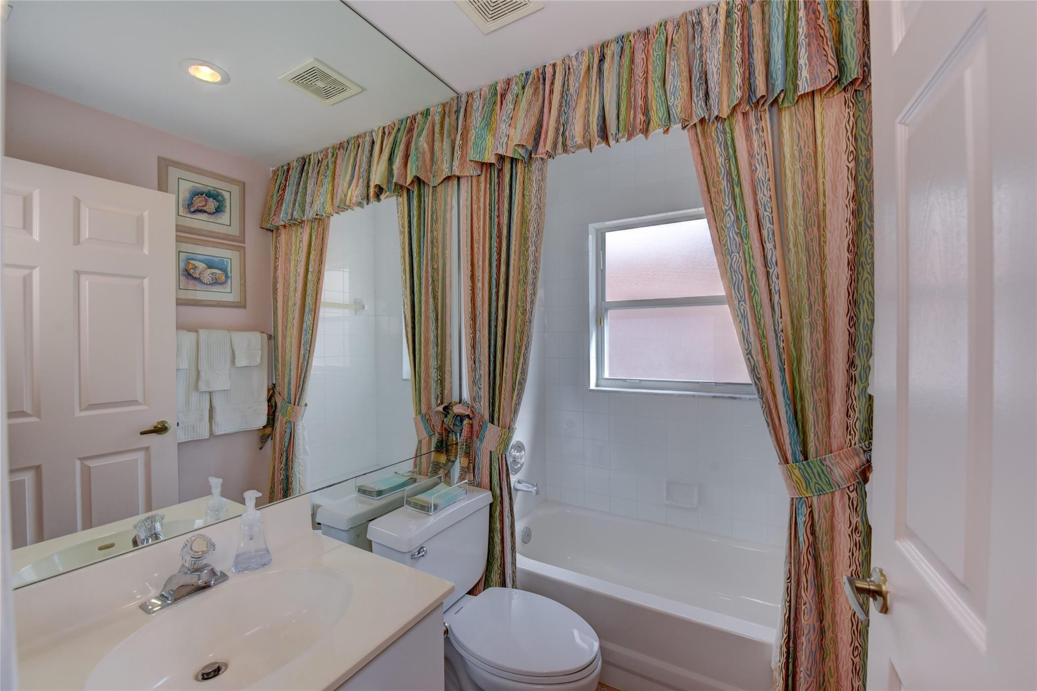 22918 Sterling Lakes Drive Boca Raton, FL 33433 - Photo 39 of 57 a bathroom with a sink toilet and shower