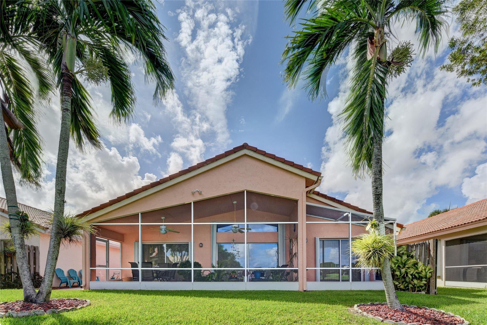 22918 Sterling Lakes Drive Boca Raton, FL 33433 - Photo 4 of 57 a view of a house with a swimming pool