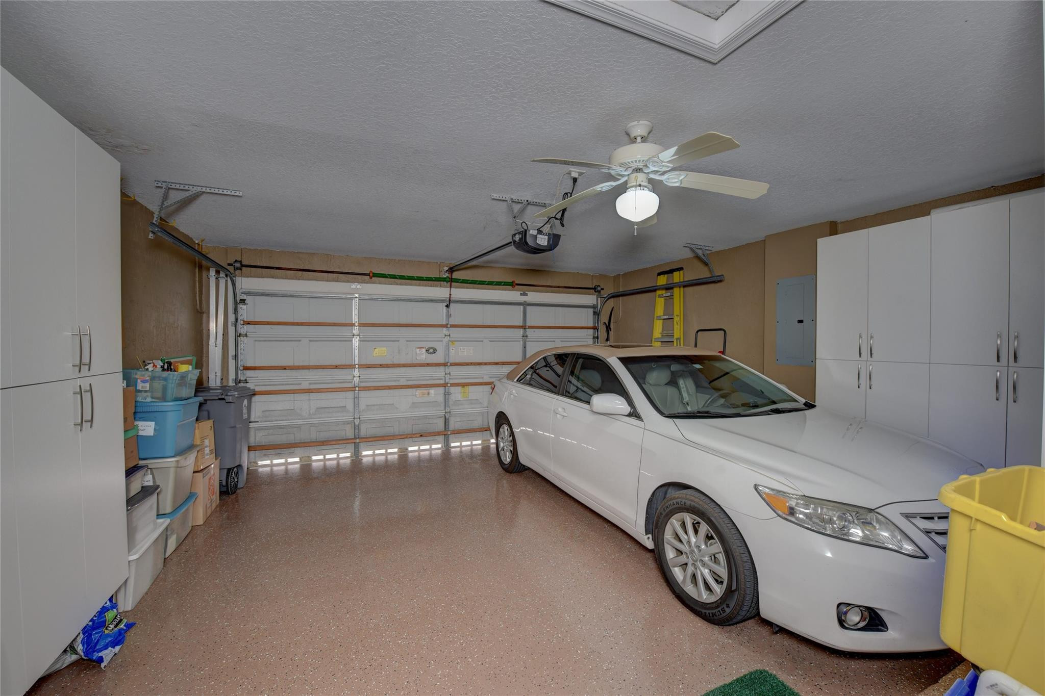 22918 Sterling Lakes Drive Boca Raton, FL 33433 - Photo 42 of 57 a view of a car garage