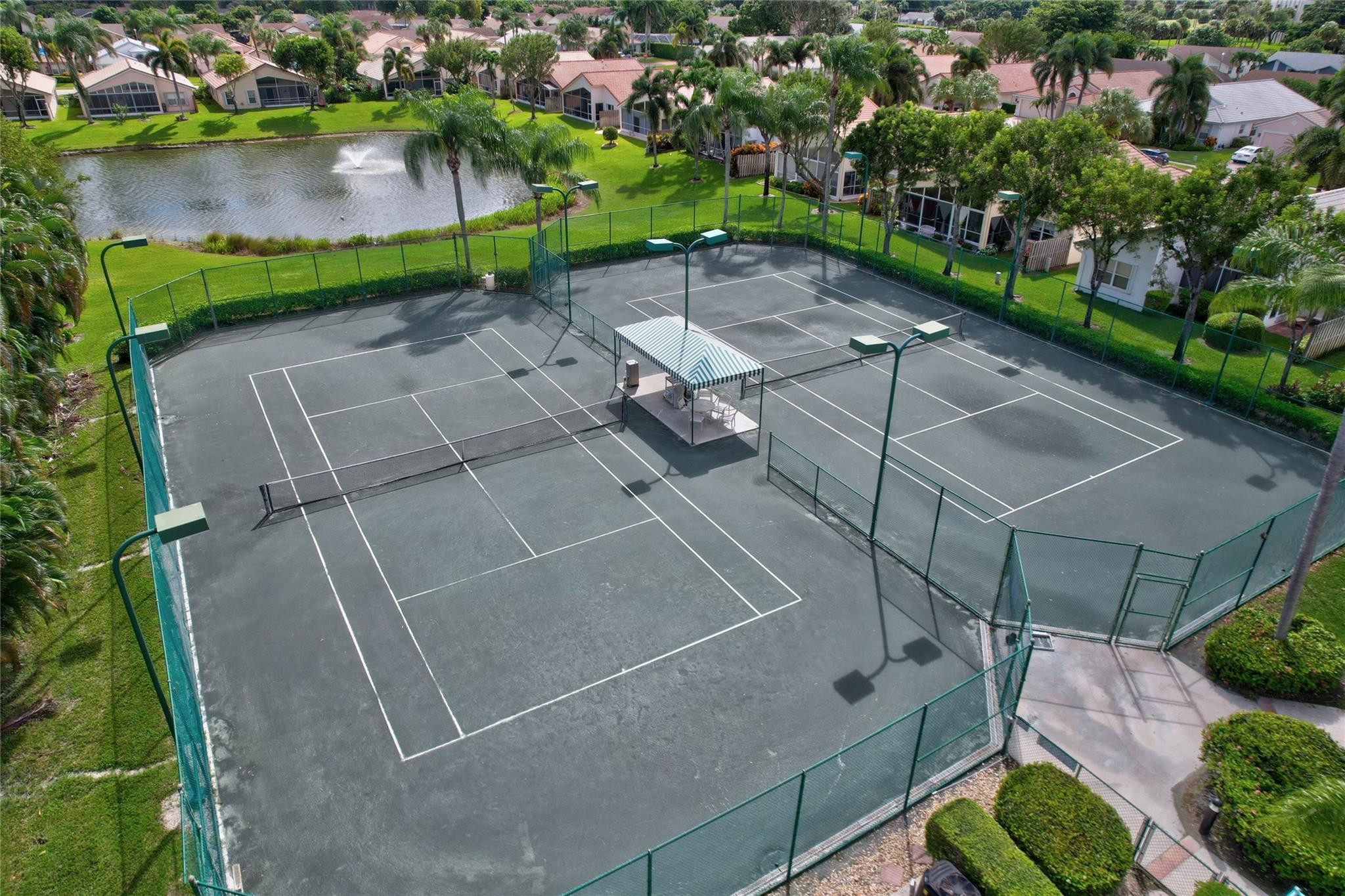22918 Sterling Lakes Drive Boca Raton, FL 33433 - Photo 55 of 57 a aerial view of a house with a yard and lake view