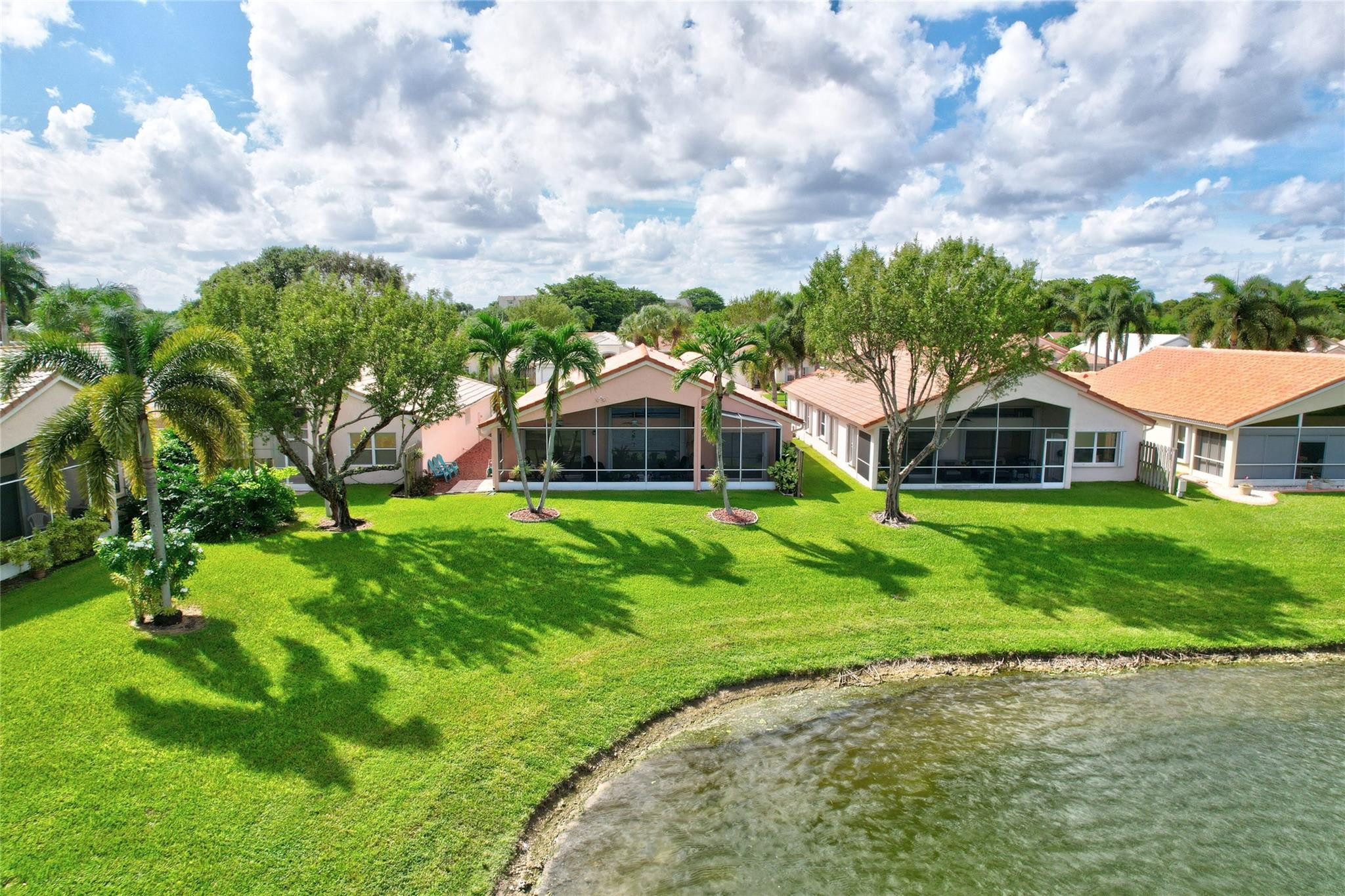 22918 Sterling Lakes Drive Boca Raton, FL 33433 - Photo 56 of 57 a front view of a house with a yard