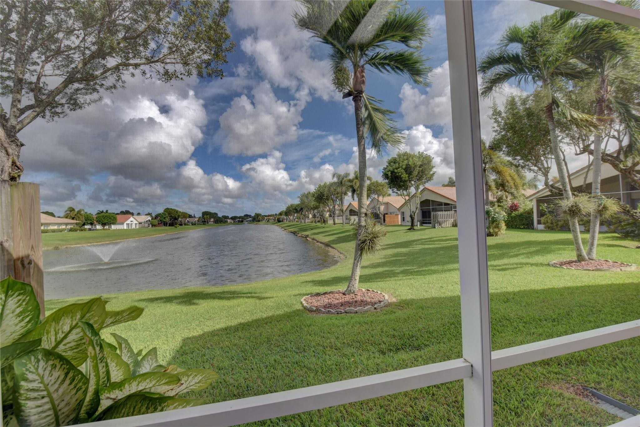 22918 Sterling Lakes Drive Boca Raton, FL 33433 - Photo 10 of 57 a view of a garden from a lake