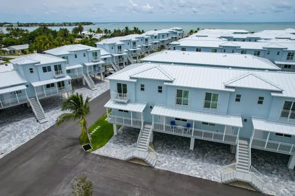 a view of a chairs and table in the patio