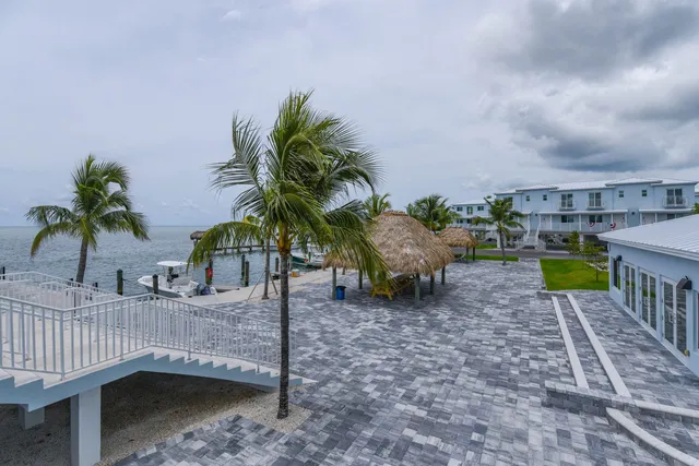 a view of a backyard patio and fire pit