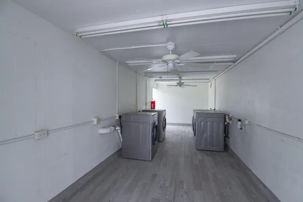 a view of a storage & utility room with wooden floor