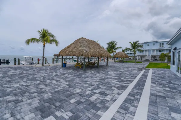 a view of a house with backyard and entertaining space