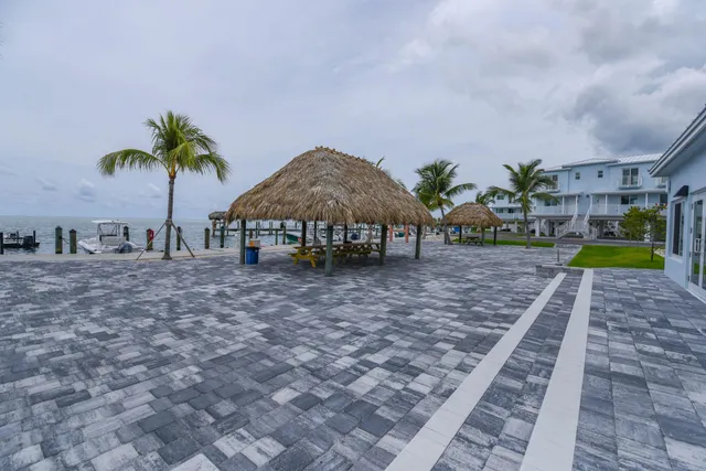 a view of a house with backyard and entertaining space