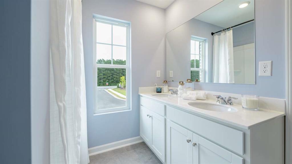 3562 Matthew Court Decatur, GA 30030 - Photo 28 of 30 a bathroom with a sink and a mirror