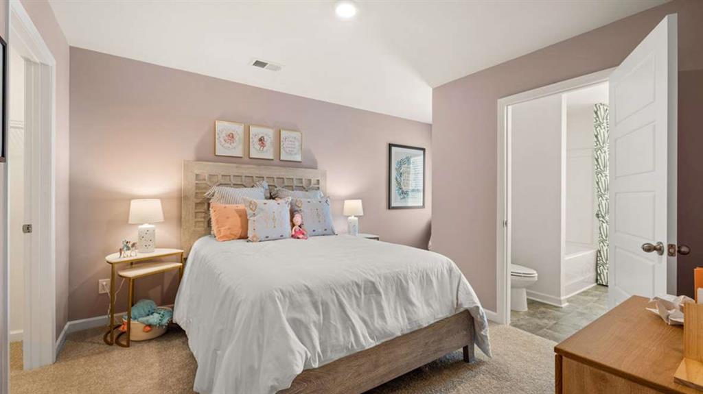 3562 Matthew Court Decatur, GA 30030 - Photo 29 of 30 a bedroom with a bed and a lamp on dresser
