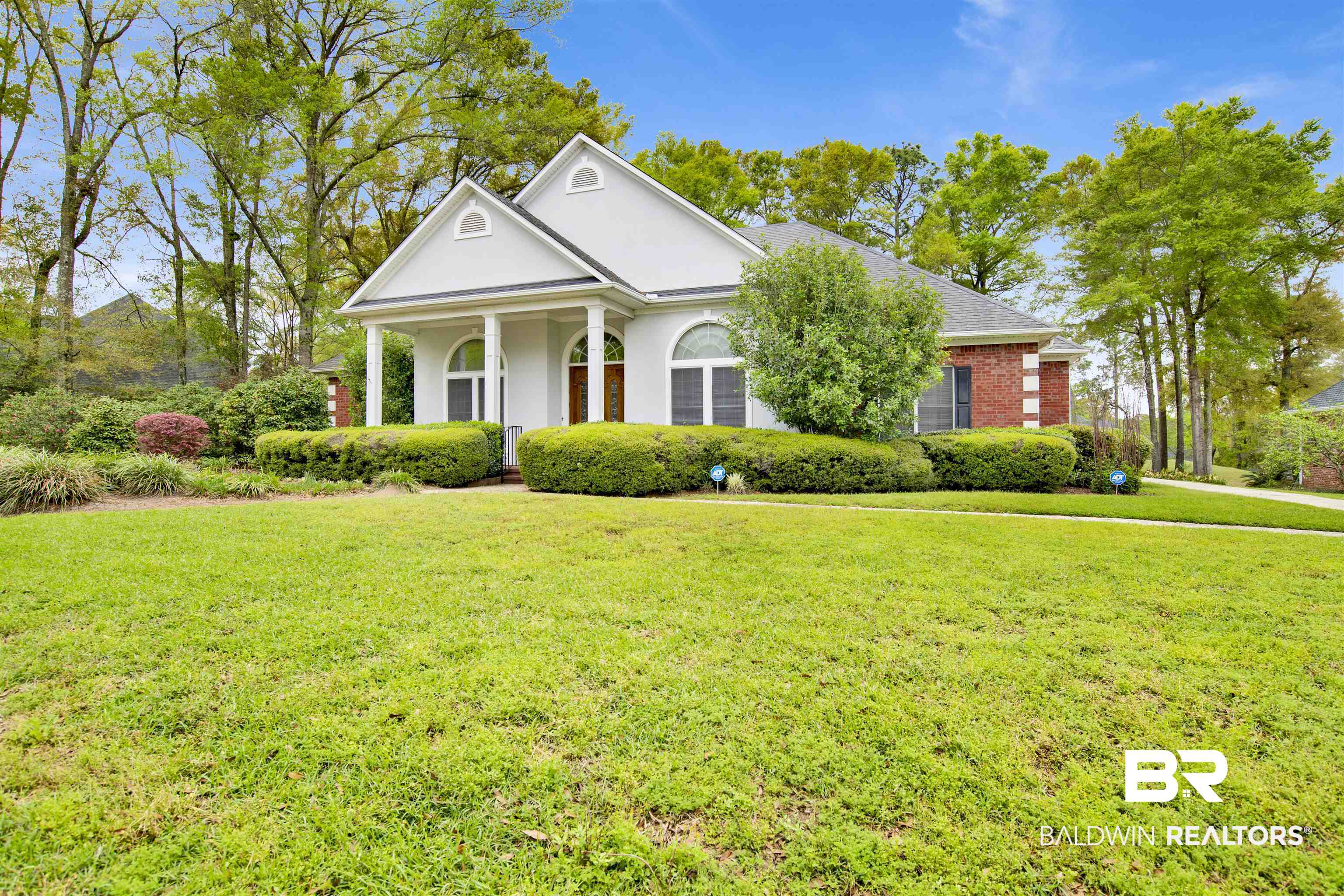 106 Old Mill Road Fairhope, AL 36532 - Photo 3 of 49 Neoclassical / greek revival house with stucco siding and a front lawn