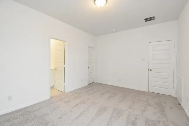 a bathroom with a granite countertop shower and a sink