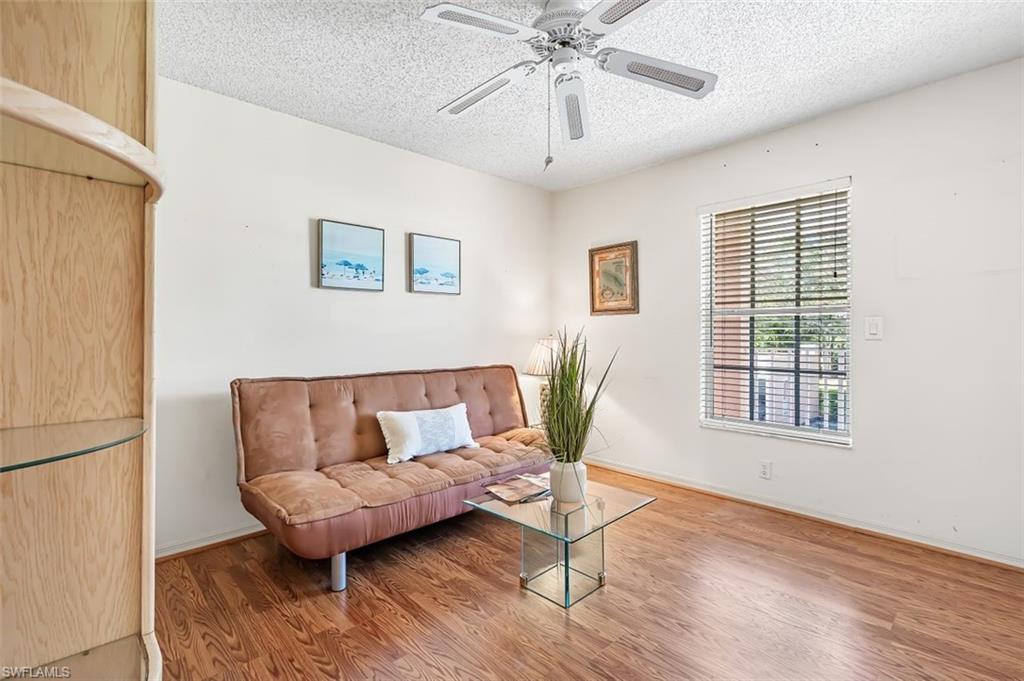555 Augusta Boulevard, Unit 36 Naples, FL 34113 - Photo 11 of 25 a living room with furniture and a window
