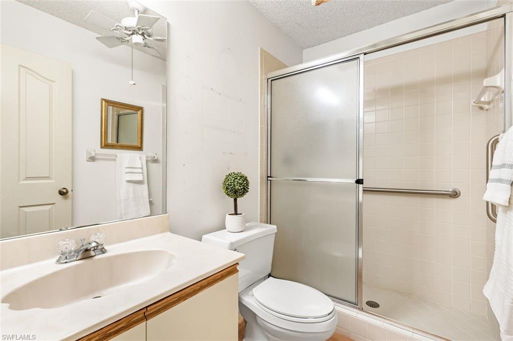 555 Augusta Boulevard, Unit 36 Naples, FL 34113 - Photo 12 of 25 a bathroom with a sink toilet and shower