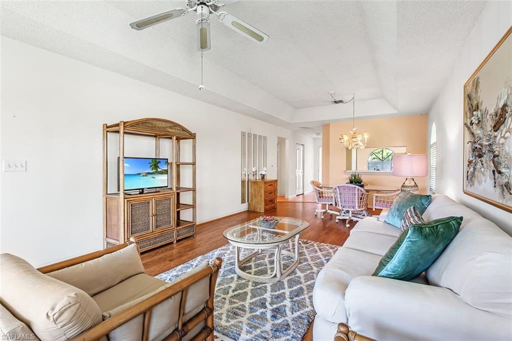 555 Augusta Boulevard, Unit 36 Naples, FL 34113 - Photo 16 of 25 a living room with fireplace furniture and a window
