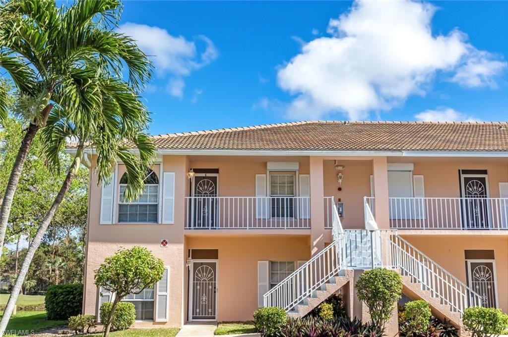 555 Augusta Boulevard, Unit 36 Naples, FL 34113 - Photo 24 of 25 a front view of a house with balcony