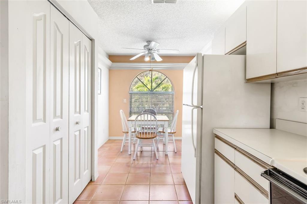 555 Augusta Boulevard, Unit 36 Naples, FL 34113 - Photo 5 of 25 a hallway with a large window and front door