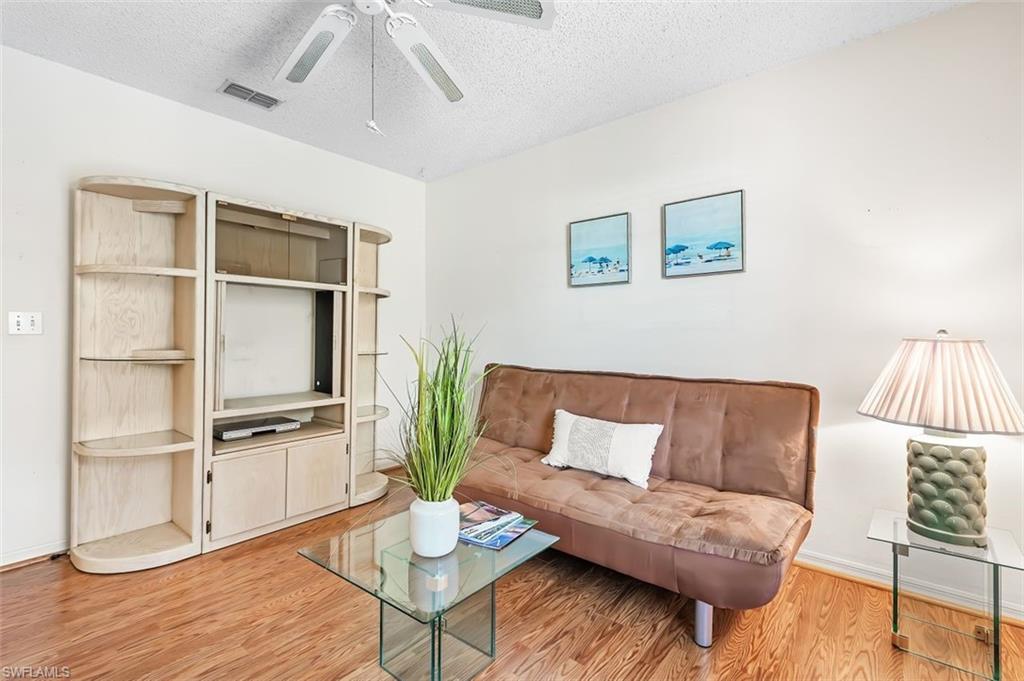 555 Augusta Boulevard, Unit 36 Naples, FL 34113 - Photo 10 of 25 a living room with furniture