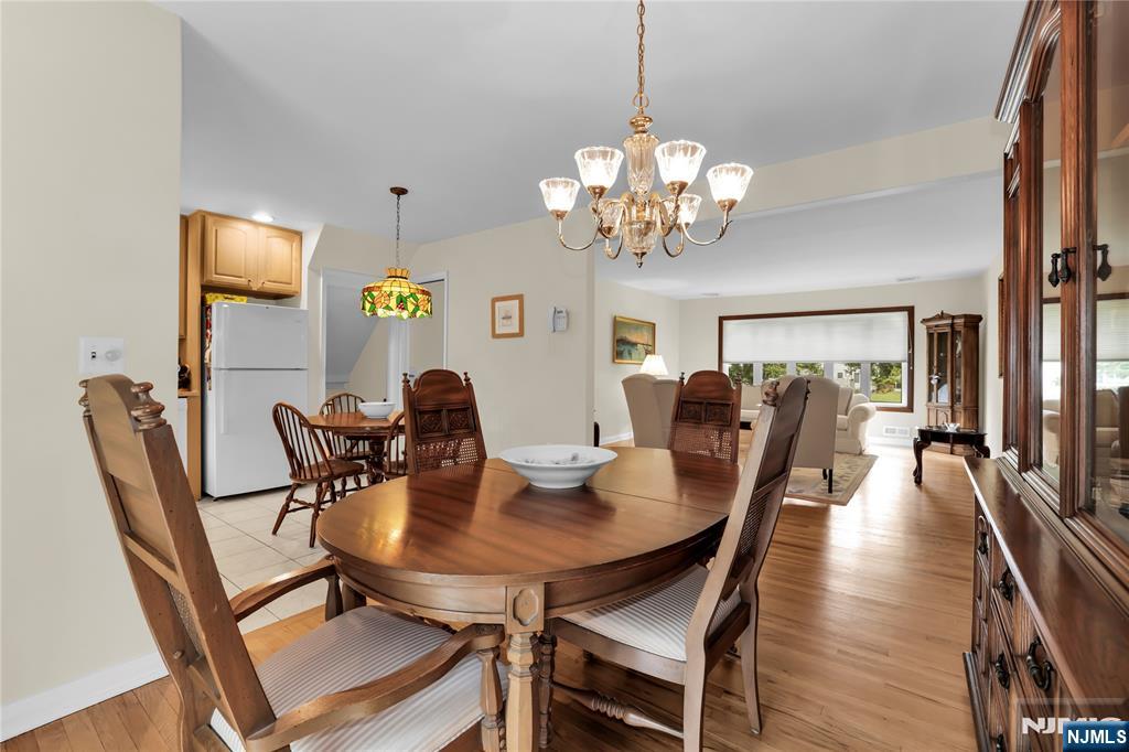 23 Ridge Court Cedar Grove, NJ 07009 - Photo 10 of 37 a view of a dining room with furniture and chandelier