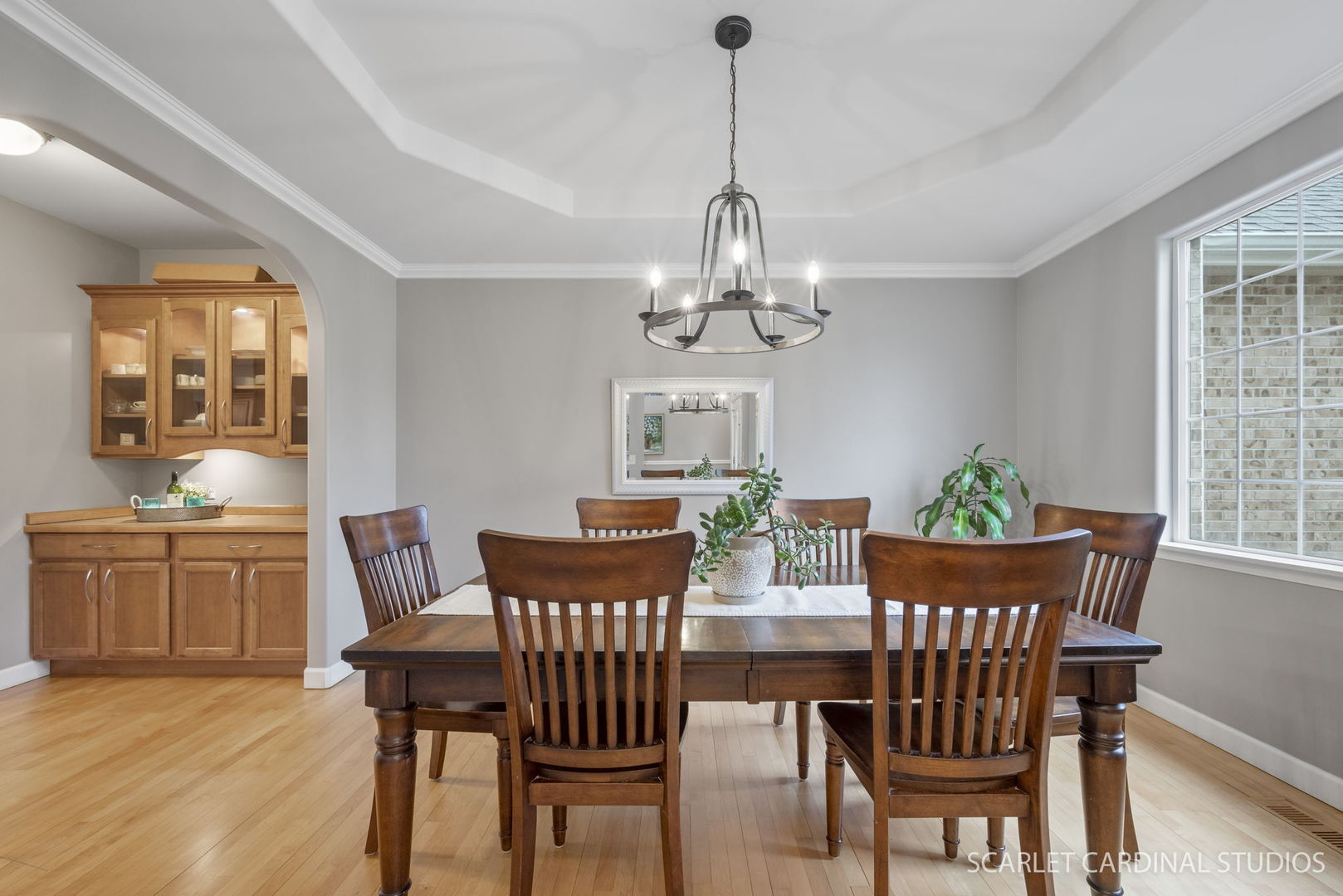 716 Cornwall Circle Sugar Grove, IL 60554 - Photo 3 of 29 a view of a dining room with furniture a chandelier and wooden floor