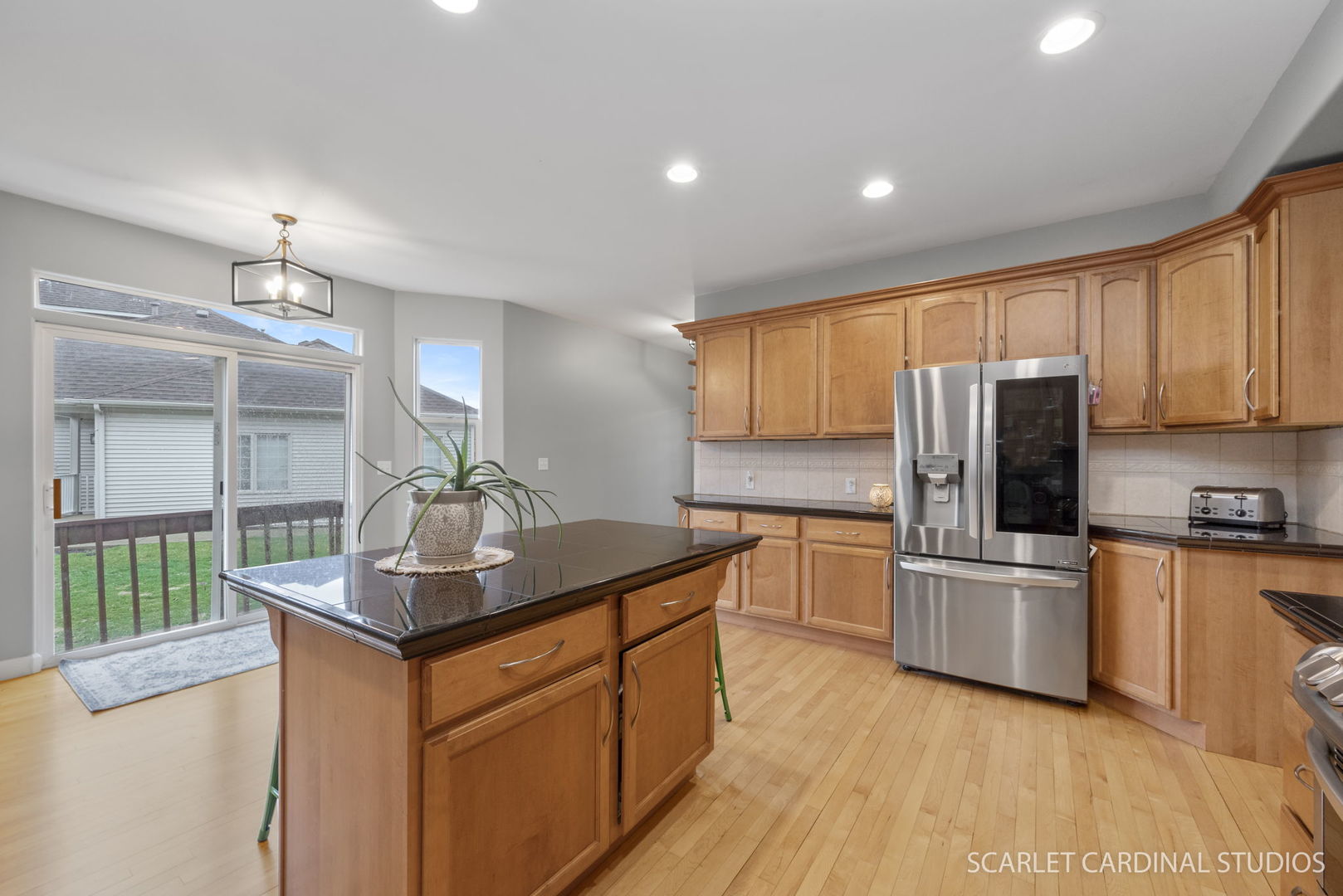 716 Cornwall Circle Sugar Grove, IL 60554 - Photo 6 of 29 a kitchen with stainless steel appliances granite countertop a sink stove and refrigerator