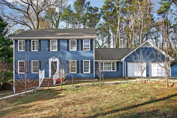 front view of a house with a yard