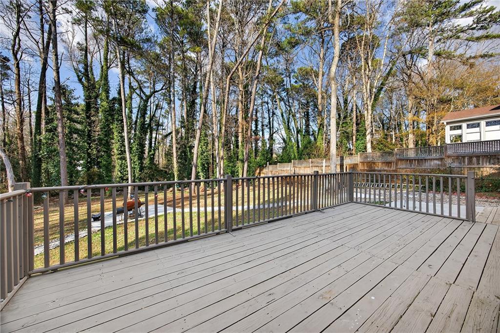 4673 Arrowhead Trail Southwest Lilburn, GA 30047 - Photo 12 of 28 a view of a wooden deck