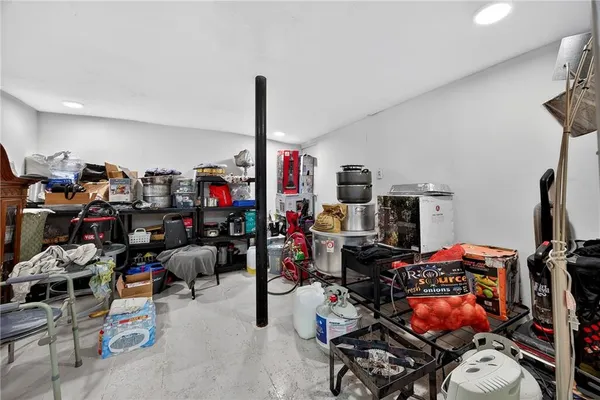 a living room with lots of furniture and gym equipment