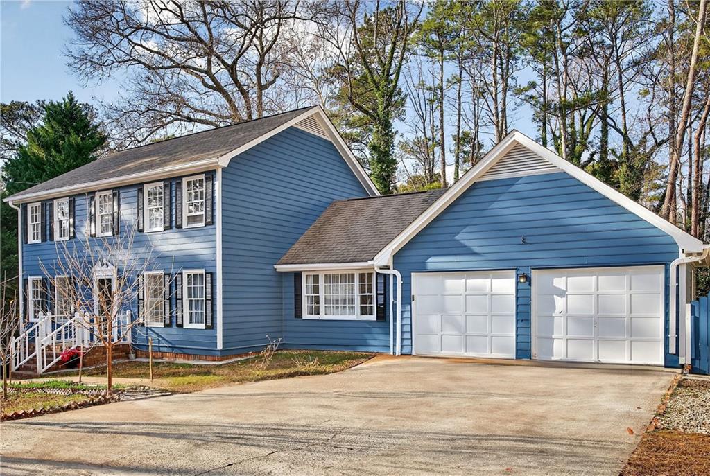 4673 Arrowhead Trail Southwest Lilburn, GA 30047 - Photo 28 of 28 a front view of house with yard