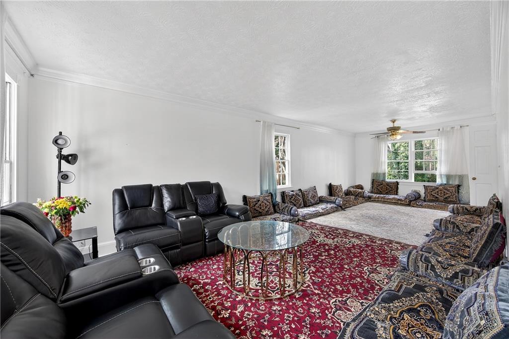 4673 Arrowhead Trail Southwest Lilburn, GA 30047 - Photo 4 of 28 a living room with furniture and a couch