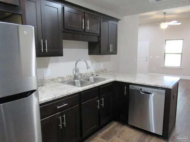 a kitchen with a sink and cabinets
