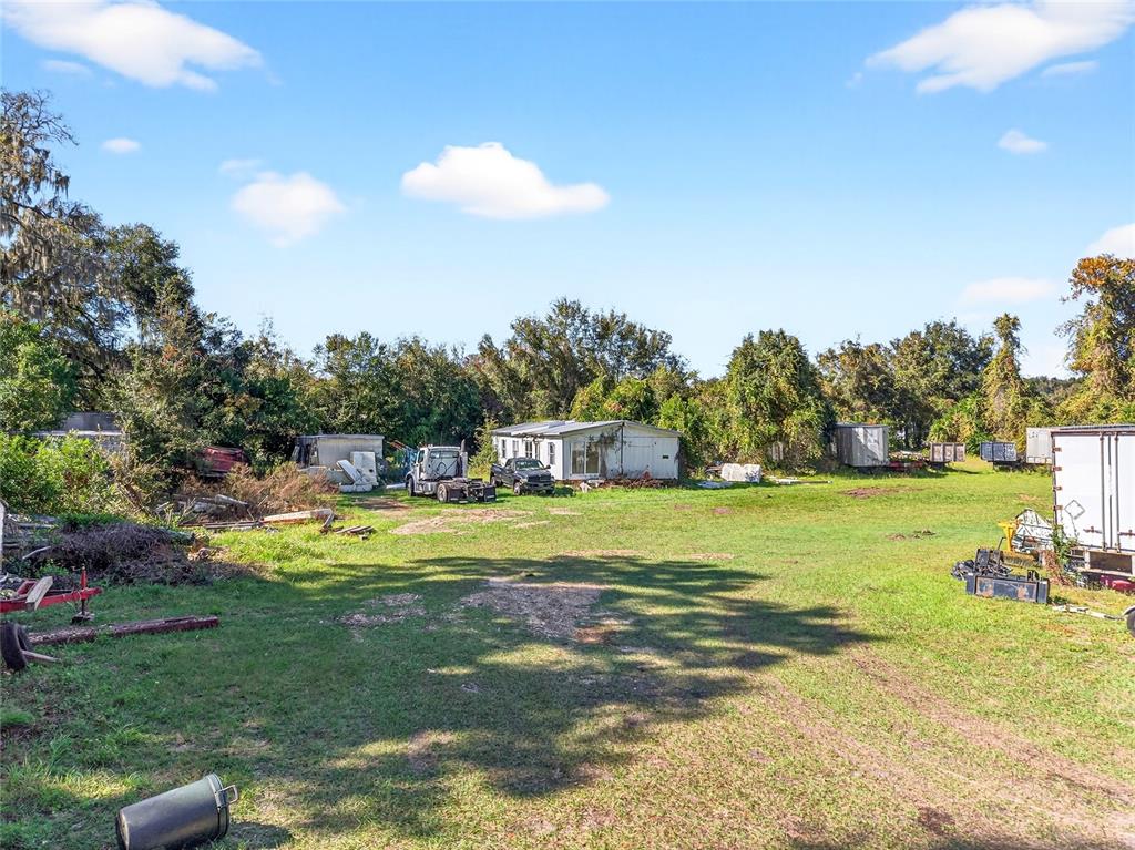10389 Southeast 50th Avenue Belleview, FL 34420 - Photo 8 of 10 a view of a house with a big yard