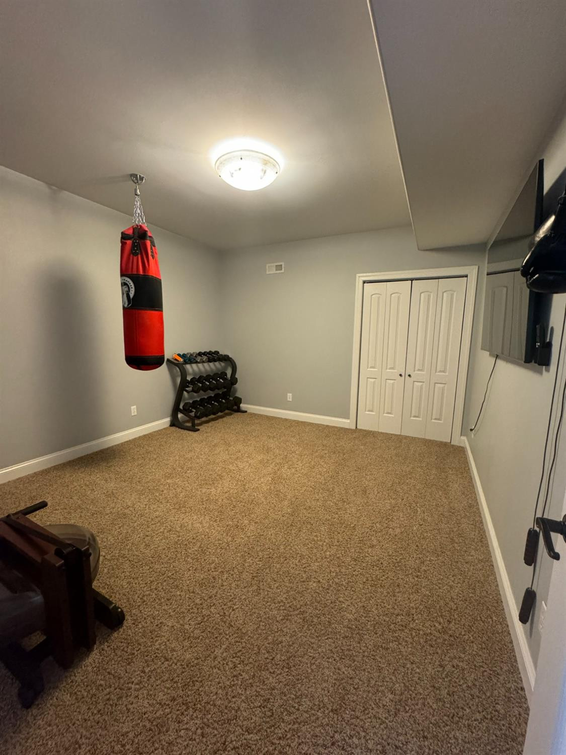9310 Doubletree Drive North Crown Point, IN 46307 - Photo 19 of 20 a room with gym equipment and view of living room