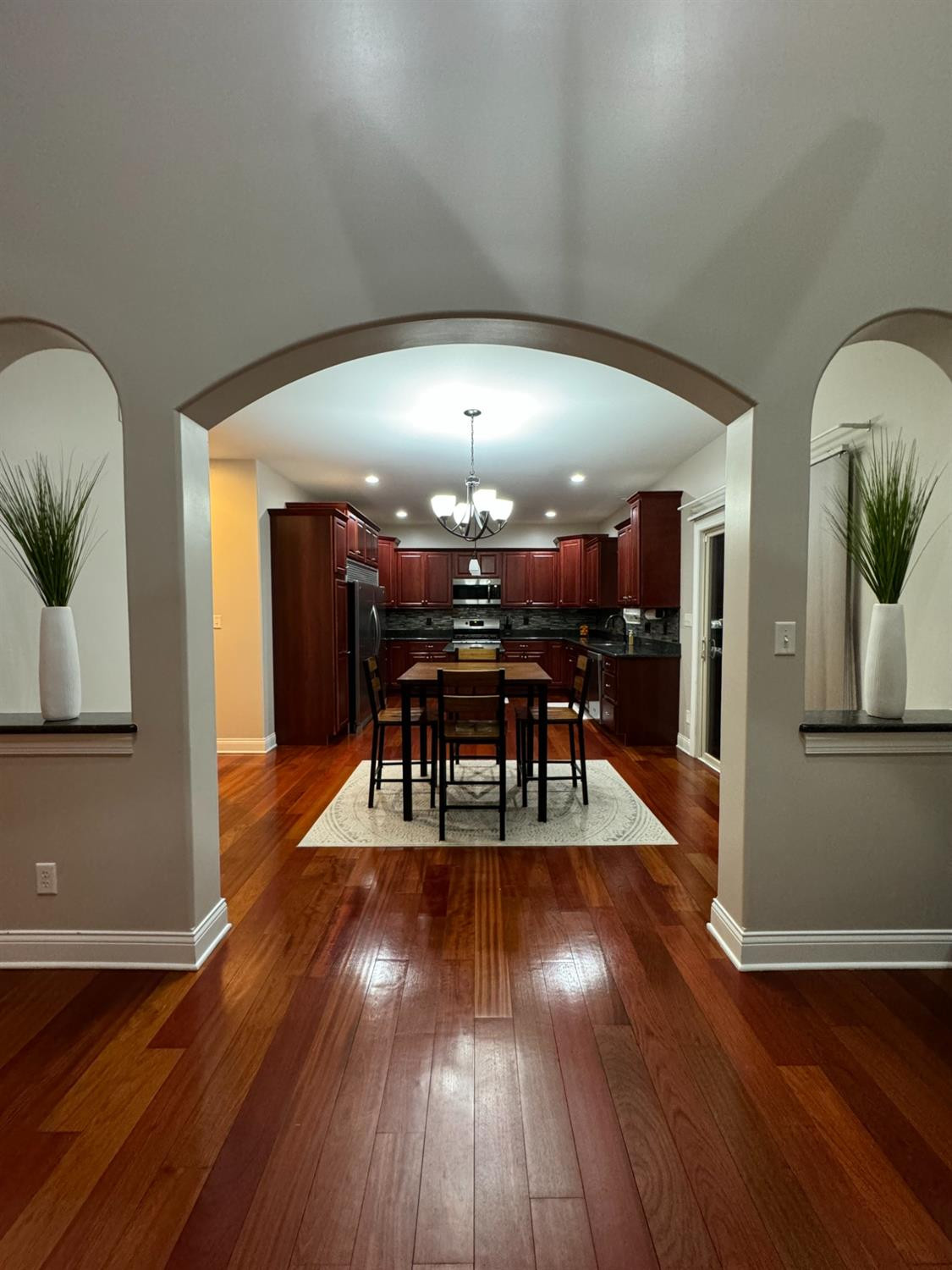 9310 Doubletree Drive North Crown Point, IN 46307 - Photo 6 of 20 a view of a dining room with furniture and wooden floor