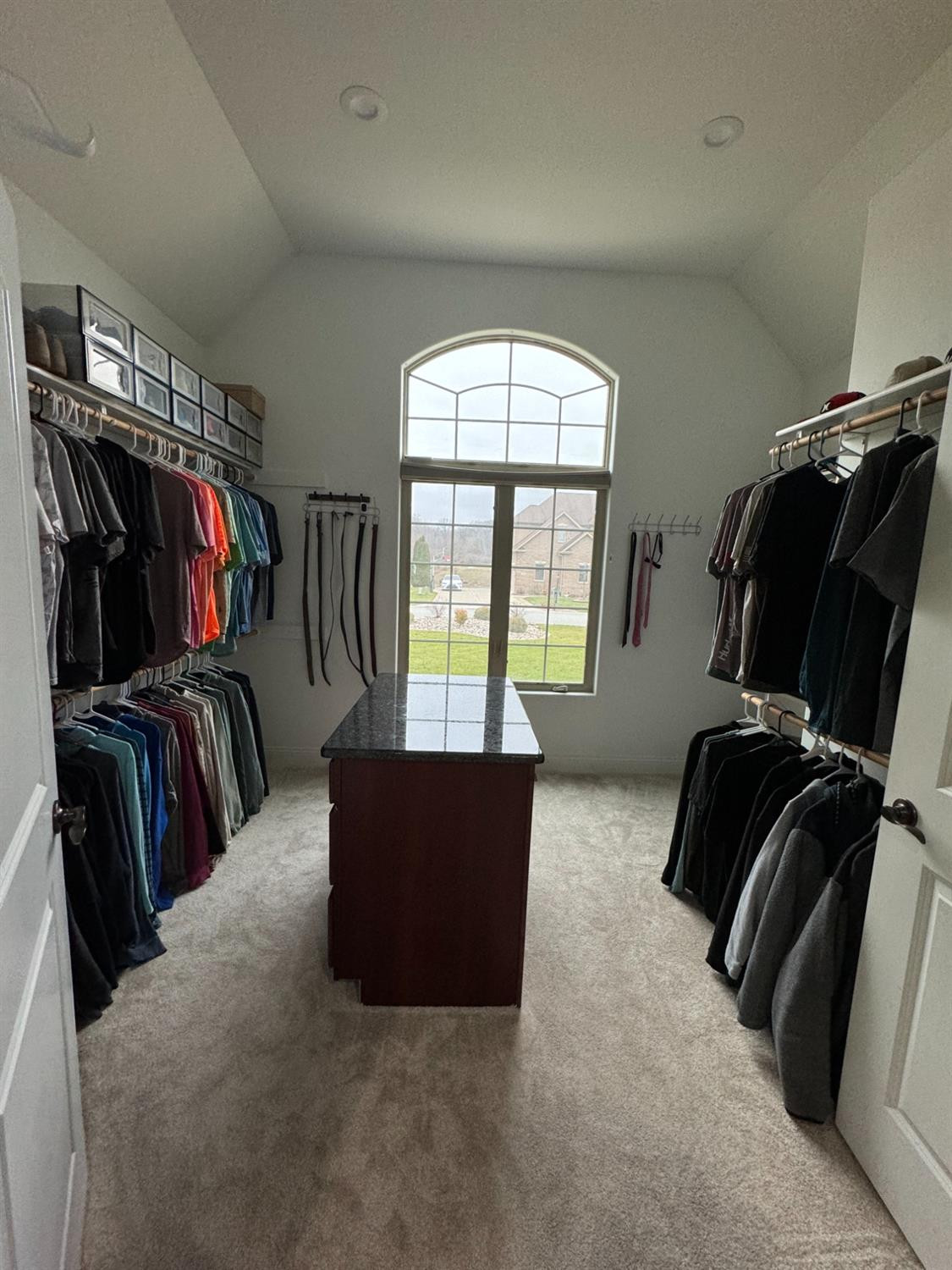 9310 Doubletree Drive North Crown Point, IN 46307 - Photo 9 of 20 a view of walk in closet with clothes and shoes
