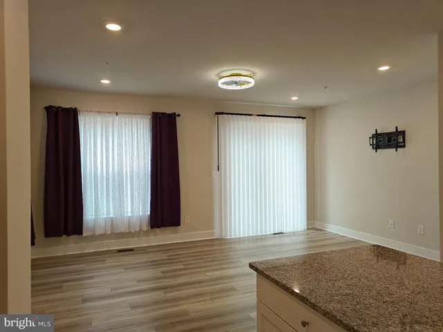 an entryway with wooden floor