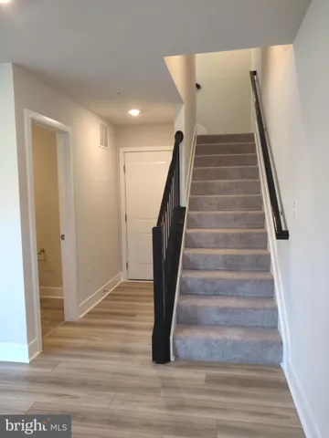 a white toilet sitting next to a bathroom sink