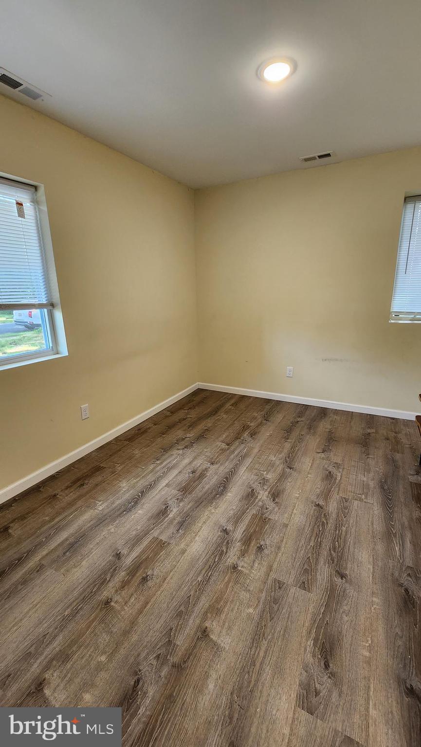 202 Holly Street Glassboro, NJ 08028 - Photo 15 of 23 an empty room with wooden floor