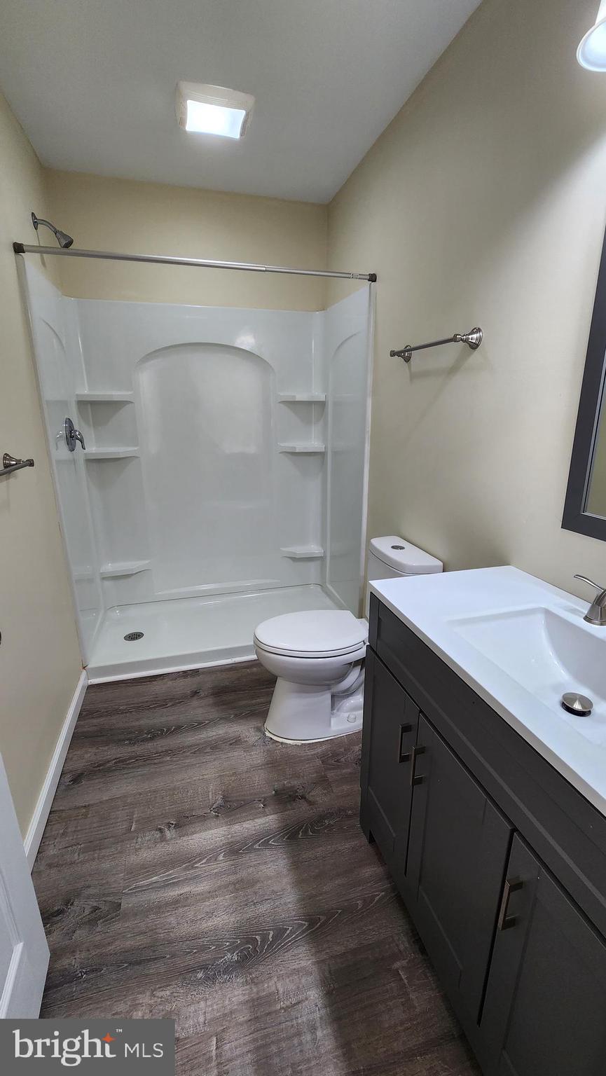 202 Holly Street Glassboro, NJ 08028 - Photo 18 of 23 a bathroom with a sink and a mirror