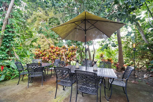 a patio with a patio table and chairs
